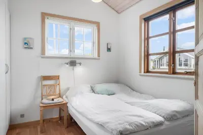 a room with two beds in it with a window at G287-Lemvig-Bellisvej-87 in Lemvig