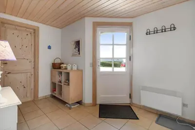 a living room with a door and a window at G287-Lemvig-Bellisvej-87 in Lemvig