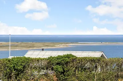 a view of the ocean with a house and a building at G287-Lemvig-Bellisvej-87 in Lemvig