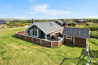 a small house on a field with a camera at 511-Lemvig-Lyngsletten-13 in Lemvig