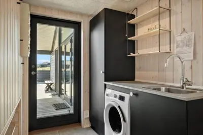 a kitchen with a sink and a washing machine at 332-Harboore-Hvilehjemsvej-20 in Harboør