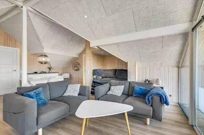 a living room with a couch and a table at 257-Harboore-Dalevej-8 in Harboør