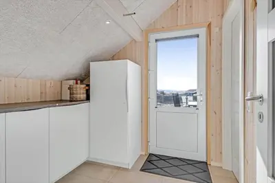 a white door in a kitchen with a window at 257-Harboore-Dalevej-8 in Harboør