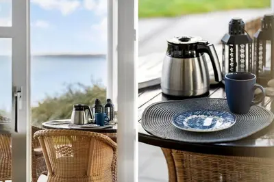 a table with a coffee maker and a tea pot on a porch at G336-Lemvig-Myntevej-36 in Lemvig