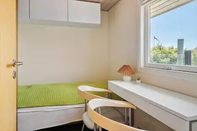a room with a desk and chairs and a window at G249-Lemvig-Bellisvej-49 in Lemvig