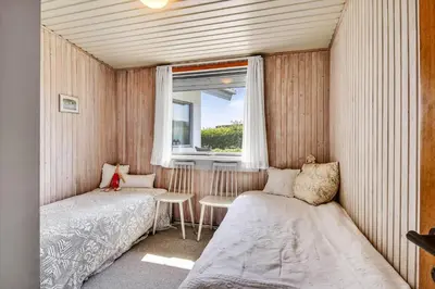 a small room with a bed and a window at G129-Lemvig-Gjelleroddevej-129 in Lemvig