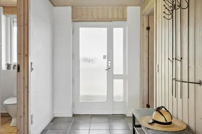 a straw hat sitting on a table in a bathroom at 114-Harboore-Strandvejen-164 in Harboør