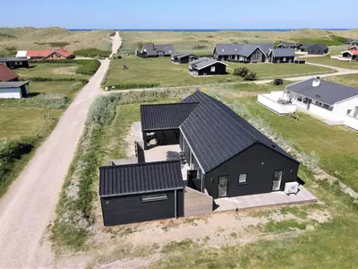 an overhead view of a black house in a field at 252-Harboore-Amazonevej-6 in Harboør