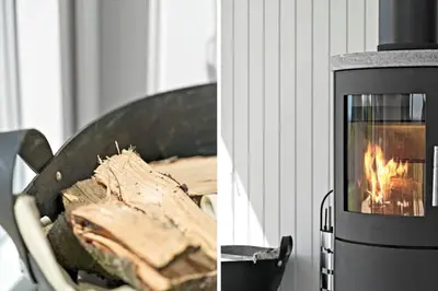 a stove with a fire inside of it next to a picture at G219-Lemvig-Skovstjernevej-19 in Lemvig