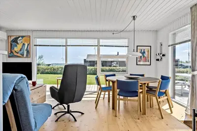a dining room with a table and chairs at G219-Lemvig-Skovstjernevej-19 in Lemvig
