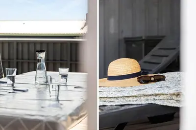 a table with a straw hat and glasses on it at 182-Harboore-Vejlby-Klit-153-a in Harboør