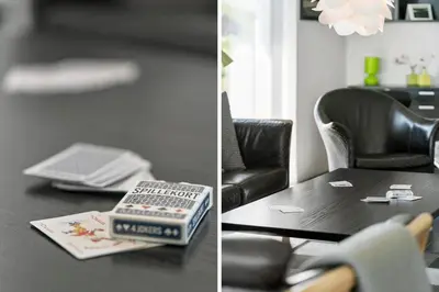 two pictures of a living room with a table and a laptop at 148-Harboore-Lucievej-6-a in Harboør