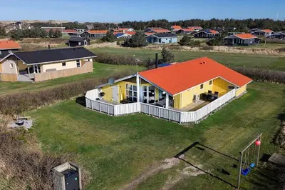 an overhead view of a house with an orange roof at 185-Harboore-Vejlby-Klit-85 in Harboør