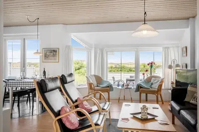 a living room with a couch and a table at 324-Harboore-Skalvej-4-b in Harboør