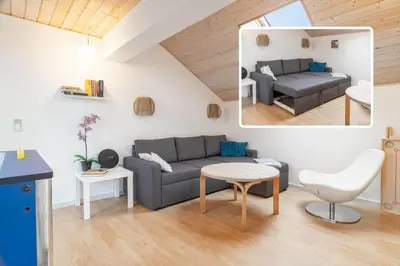 a living room with a couch and a table at 149-Harboore-Vejlby-Klit-175 in Harboør