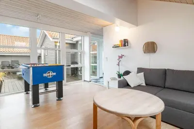 a living room with a couch and a table at 149-Harboore-Vejlby-Klit-175 in Harboør