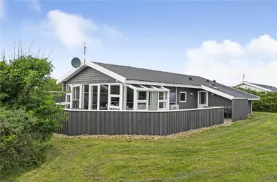 a house with a fence in front of it at 145-Harboore-Neerlandiavej-98 in Harboør