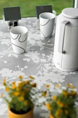 three cups sitting on top of a table with flowers at G103-Lemvig-Klovervej-3 in Lemvig