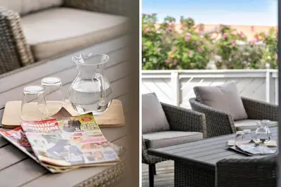 a patio table with a magazine and a glass vase at 121-Harboore-Vejlby-Klit-173-a in Harboør