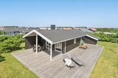 an overhead view of a house with a large deck at 292-Harboore-Neerlandiavej-76 in Harboør