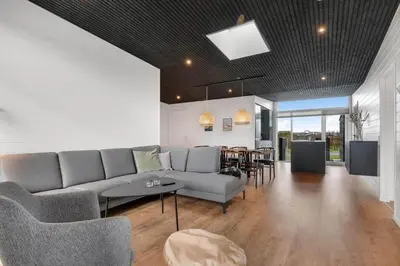 a living room with a couch and a table at G408-Lemvig-Violvej-8 in Lemvig