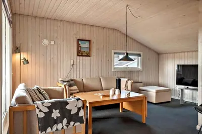 a living room with a couch and a table at 138-Harboore-Neerlandiavej-6 in Harboør
