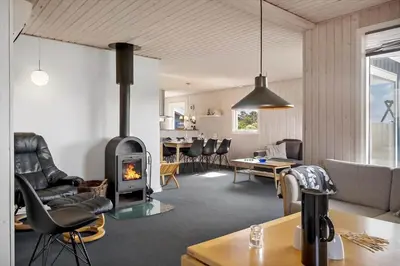 a living room with a wood stove in it at 138-Harboore-Neerlandiavej-6 in Harboør