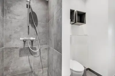 a bathroom with a shower and a toilet at 255-Harboore-Vejlby-Klit-37-A in Harboør