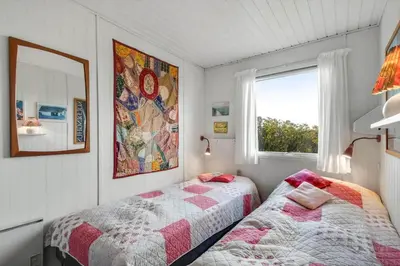 a bedroom with two beds and a window at G230-Lemvig-Gyvelvej-30 in Lemvig
