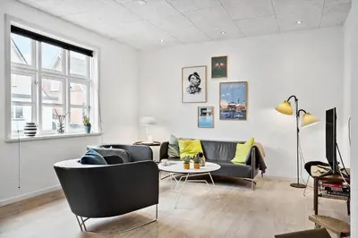 a living room with a couch and a table at 713-Thyboron-Vesterhavsgade-34 in Thyborøn