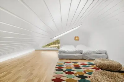 a living room with a couch and a rug at 375-Harboore-Gloryvej-14-A in Harboør