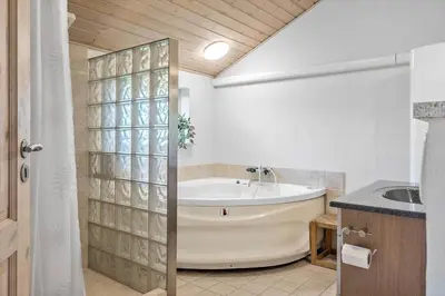 a bathroom with a tub and a sink at G124-Lemvig-Porsevej-24 in Lemvig