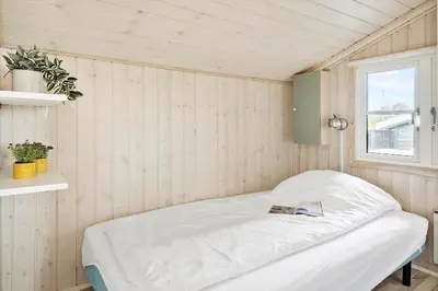 a room with a bed in a room with a window at G305-Lemvig-Porsevej-105 in Lemvig