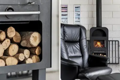 a black chair sitting next to a fire oven at G193-Lemvig-Bellisvej-93 in Lemvig