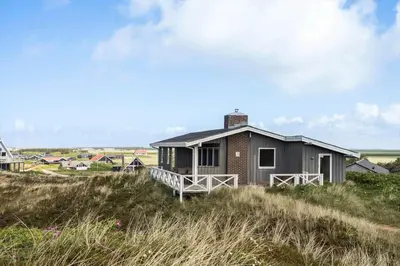 a house on top of a hill in a field at 218-Harboore-Dalevej-6-a in Harboør