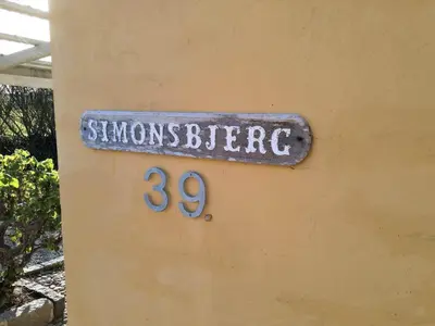 a sign on the side of a building with the number at 369-Lemvig-Klostervej-39 in Lemvig