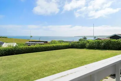 a view of the ocean from the balcony of a house at G120-Lemvig-Gyvelvej-20 in Lemvig