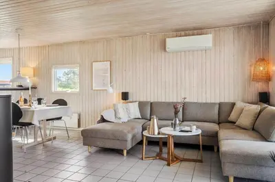 a living room with a couch and a table at 801-Harboore-Vejlby-Klit-89 in Harboør
