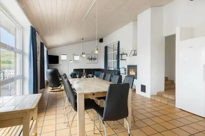 a dining room with a table and chairs at 803-Harboore-Merchantvej-9-A in Harboør