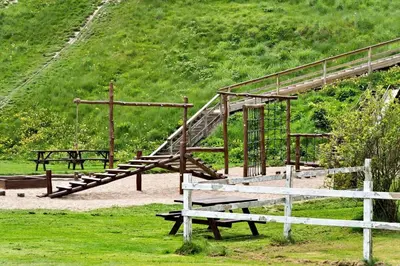 a park with benches and a wooden stair case at G410-Lemvig-Porsevej-10 in Lemvig