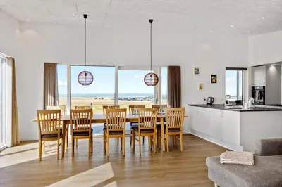 a kitchen and dining room with a table and chairs at G422-Lemvig-Pragtstjernevej-22 in Lemvig