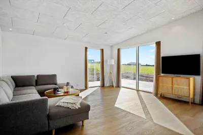 a living room with a couch and a flat screen tv at G422-Lemvig-Pragtstjernevej-22 in Lemvig