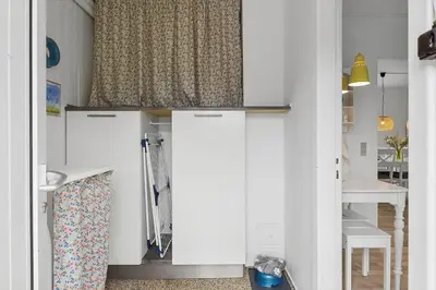 a kitchen with white cabinets and a window at 727-Thyboron-Magevej-10 in Thyborøn