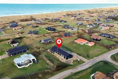 an aerial view of a group of houses with a street sign at 809-Harboore-Vejlby-Klit-32 in Harboør