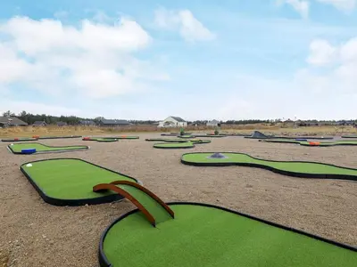 a bunch of green golf courses in a field at 6 person holiday home in Brovst-By Traum in Brovst