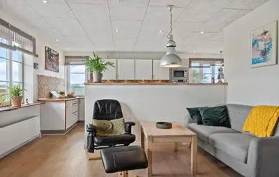 a living room with a couch and a table at Stunning Home In Harboøre With Wifi in Harboør