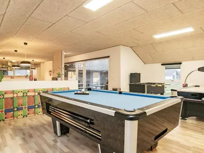 a pool table in the middle of a room at Holiday home for 24 guests, Brovst in Brovst