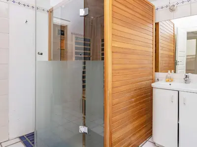 a shower with a glass door in a bathroom at Scenic Retreat in Boddum - By Traum Ferienwohnungen in Boddum