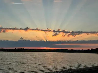 a sunset over a body of water at 10 person holiday home in Karby-By Traum in Karby