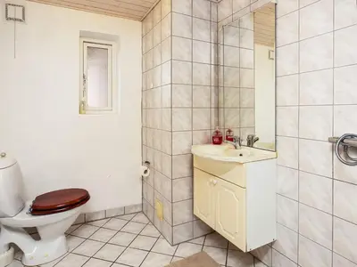 a bathroom with a toilet and a sink at 10 person holiday home in Karby-By Traum in Karby